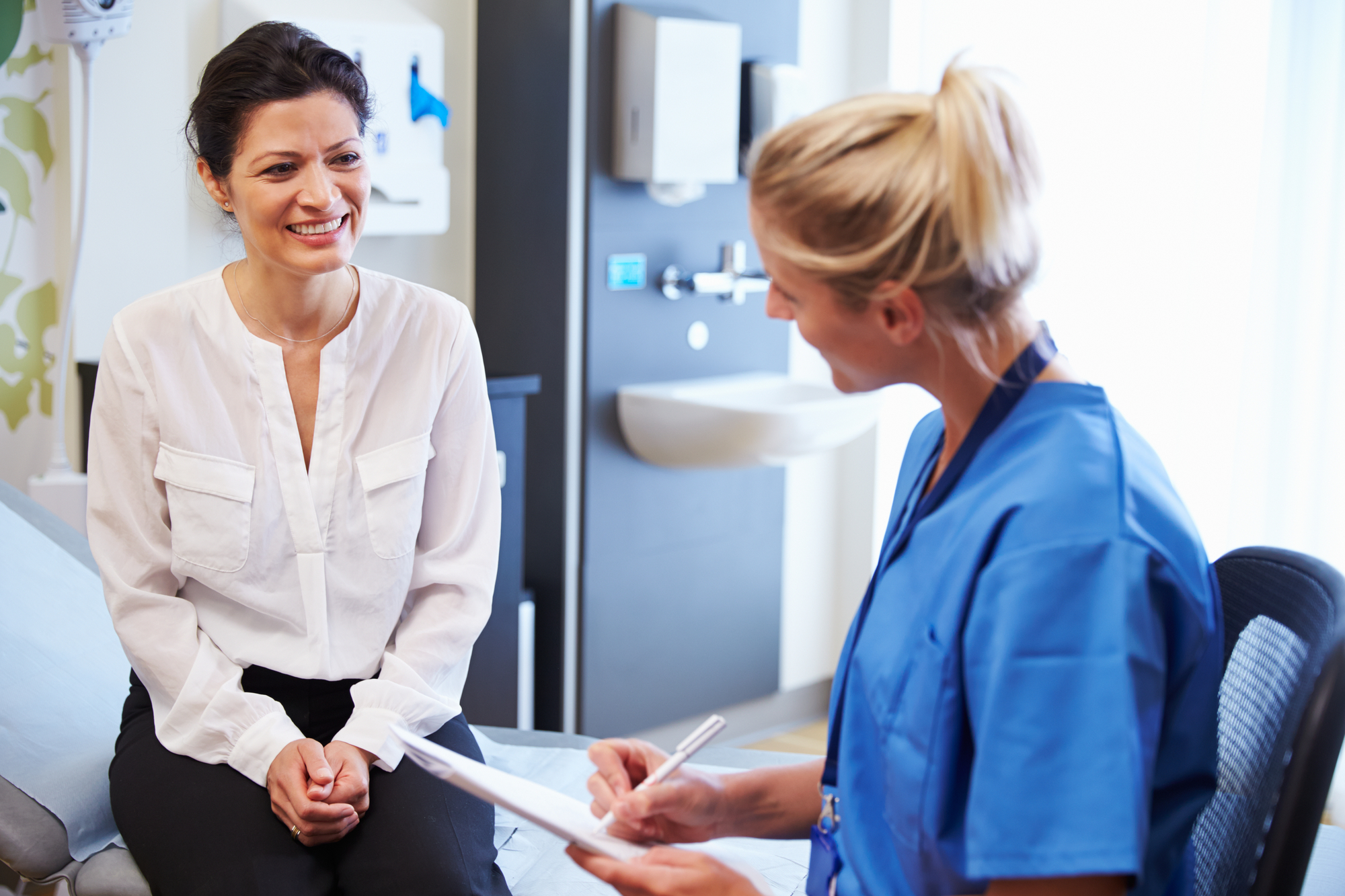 Female Patient And Doctor Have Consultation